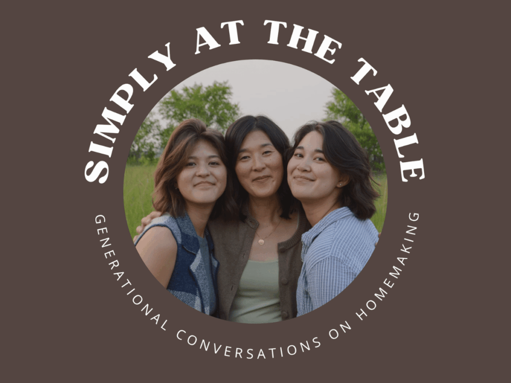 simply at the table logo with 3 women hugging